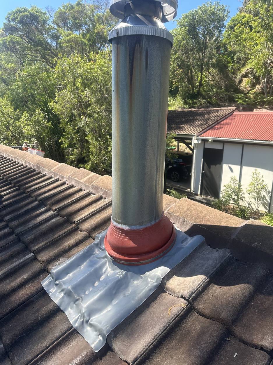 New flashing collar fitted around the flue