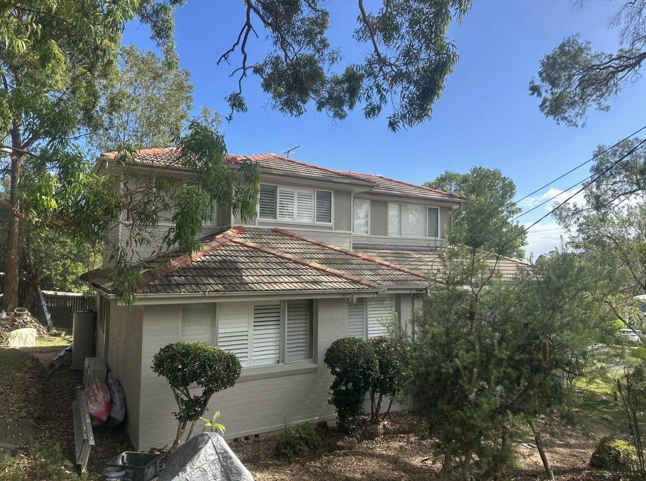 Tired, weathered tile roof before restoration